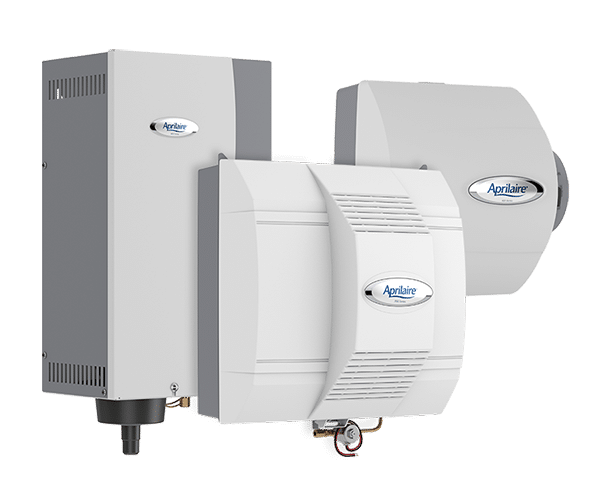 The image shows three different models of Aprilaire humidifiers. The units are white or light grey, and each features the Aprilaire logo on its front. The humidifiers have various shapes and attachment points, indicating different models or designs.